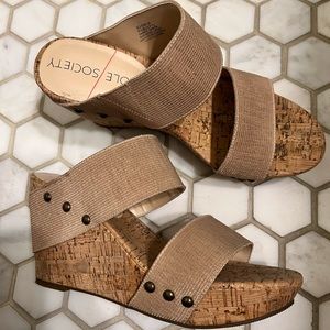 Wedge slip-ons. Nude and cork colored.